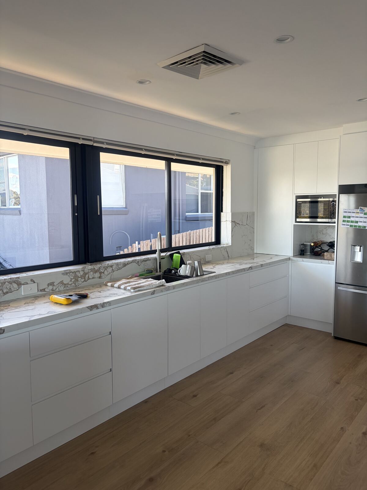 Kitchen with marble splashback and island